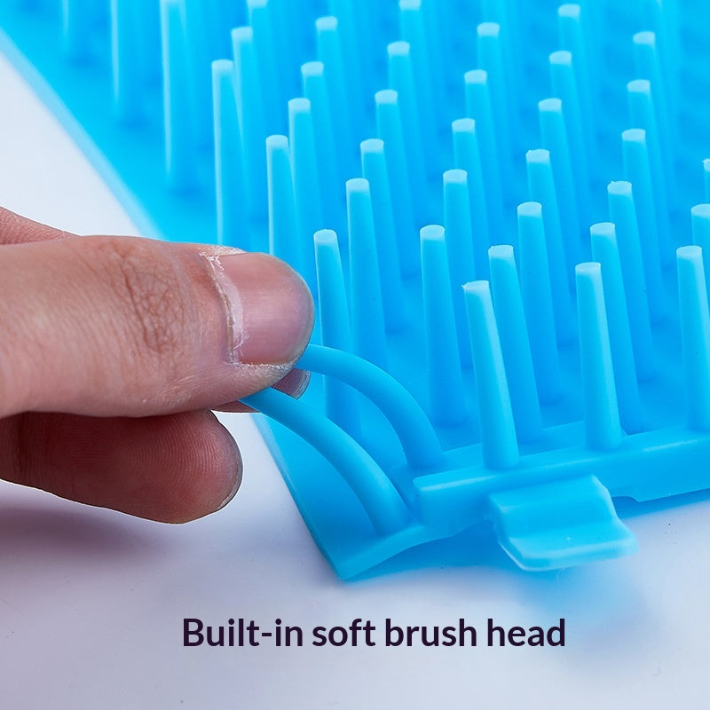 Hand bending the blue inner brush insert from a portable dog paw cleaner cup