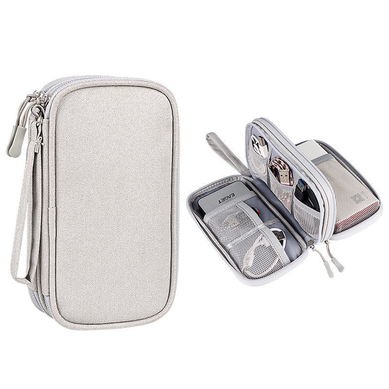 Light-colored tech organizer pouch shown closed and open.