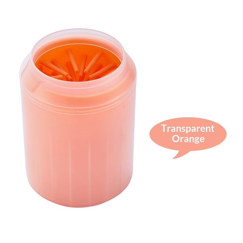 Transparent orange portable dog paw cleaner cup shown on a white background