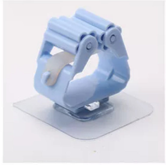 Blue cleaning-tool holder with an adhesive mounting pad.