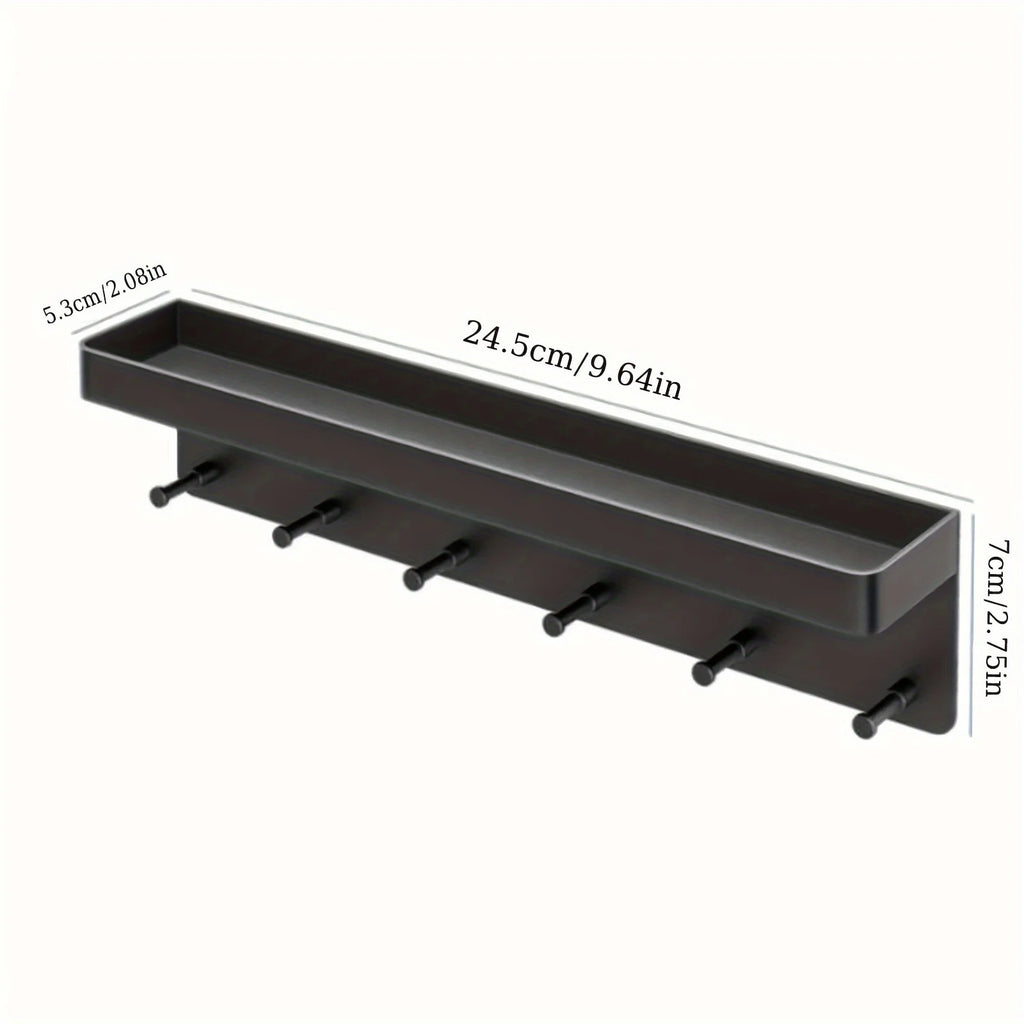 Product dimension diagram of black wall-mounted key holder with mail organizer shelf on white background: 24.5cm (9.64in) wide, 5.3cm (2.08in) deep, 7cm (2.75in) tall, with 6 protruding peg hooks along the front