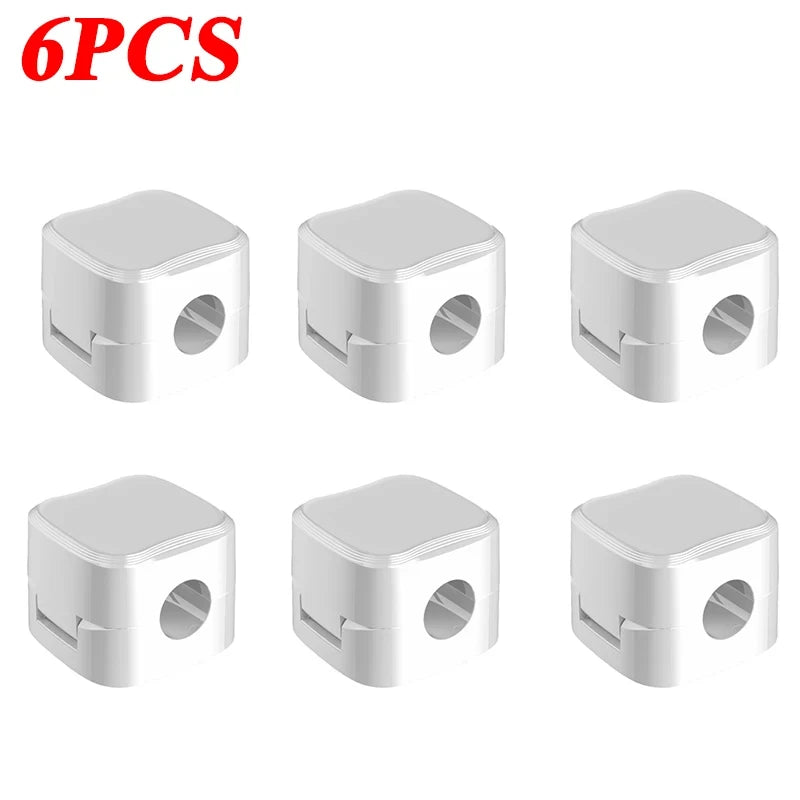 Six white magnetic cable organizer clips shown on a white background