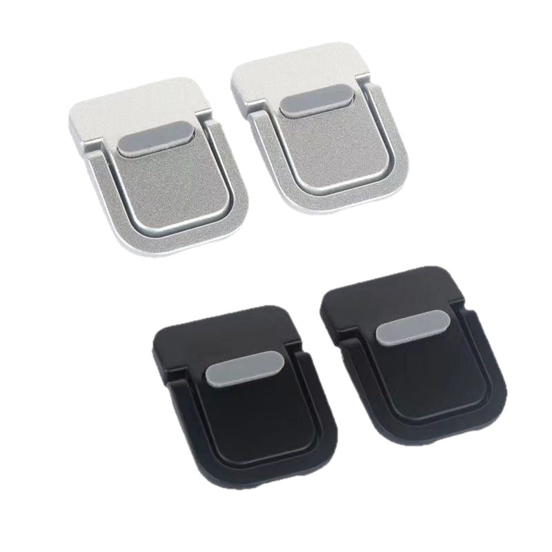 Pairs of silver and black portable laptop kickstands folded flat
