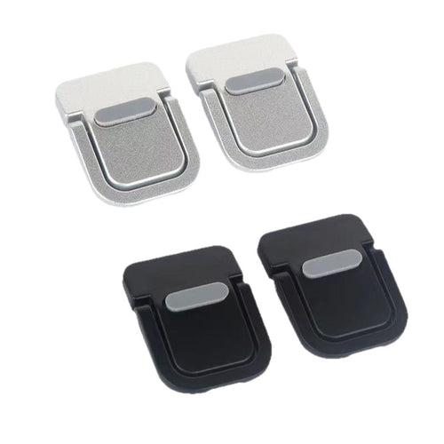 Pairs of silver and black portable laptop kickstands folded flat
